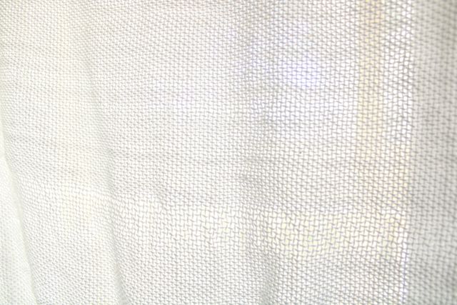 Fabric of handwoven curtains up close.